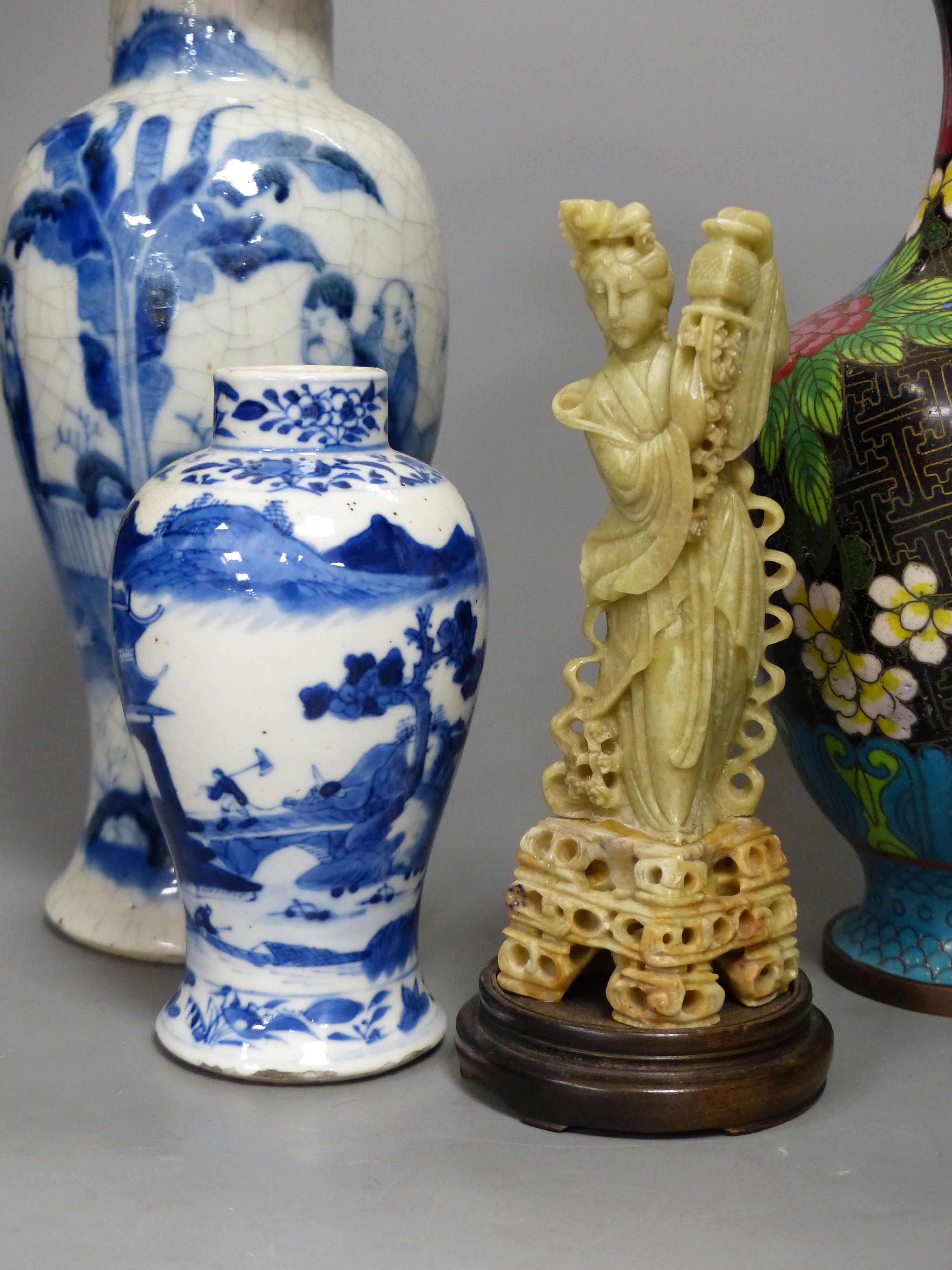 Three Chinese blue and white vases, a cloisonne enamel vase, another vase and a soapstone figure